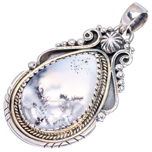 Sterling silver oval pendant with dendrite opal center, decorative side details and bail