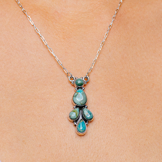 Turquoise pendant necklace with teardrop stones on a sterling silver chain