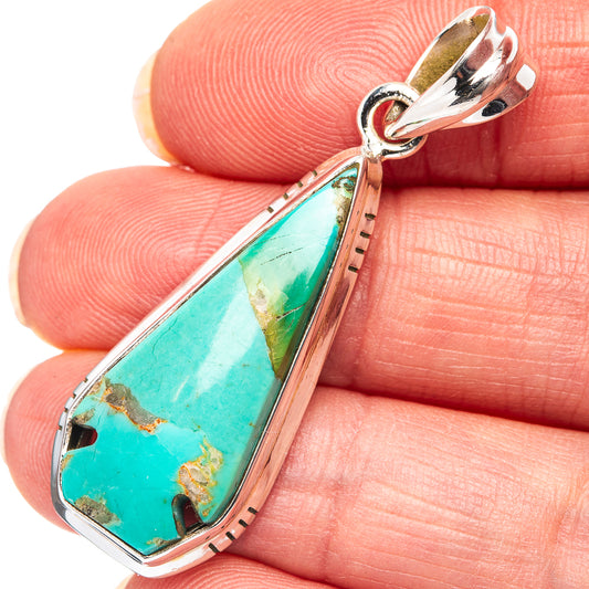 Sterling silver turquoise teardrop pendant with openwork bail and bezel setting