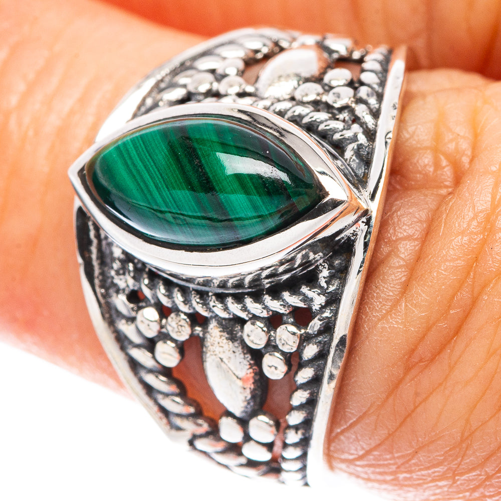 Sterling silver malachite ring with oval green gemstone centerpiece and ornate filigree band