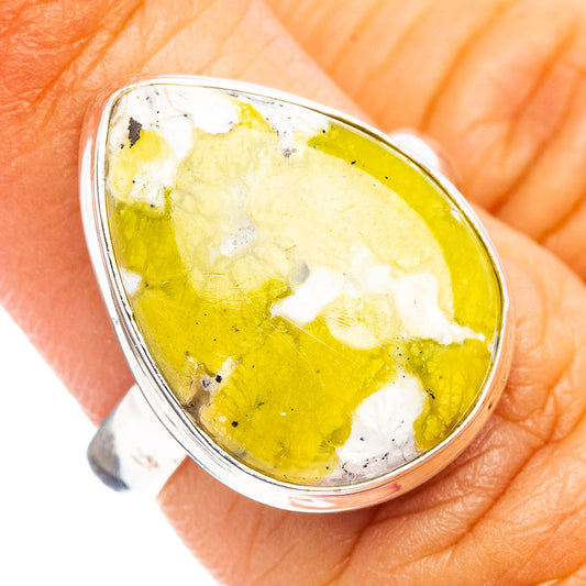 Sterling silver lizardite cabochon ring with oval yellow-green gemstone in bezel