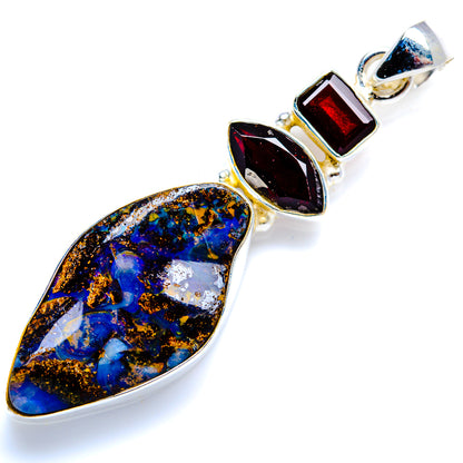 Sterling silver pendant with large teardrop boulder opal, red and dark stone accents