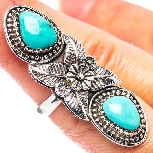 Sterling silver turquoise ring with two oval turquoise cabochons and floral engraving