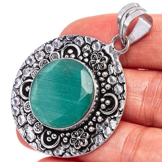 Green agate pendant with round cabochon, ornate German silver bezel and loop bail.