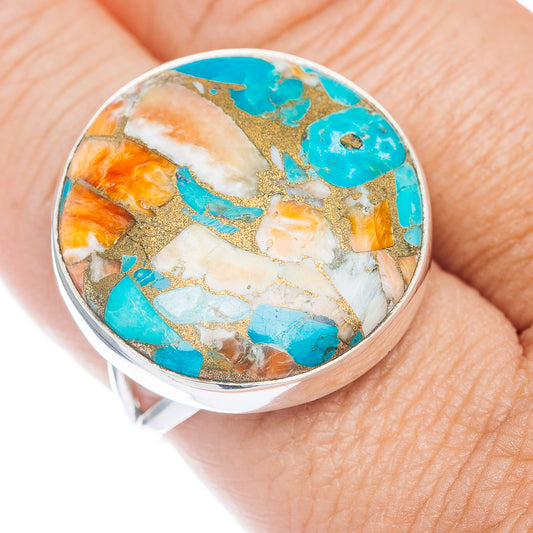 Sterling silver ring with oval turquoise, orange, and white stone inlaid