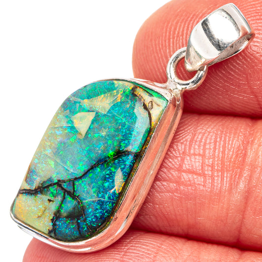 Sterling silver opal pendant with teardrop stone in green-blue iridescent pattern