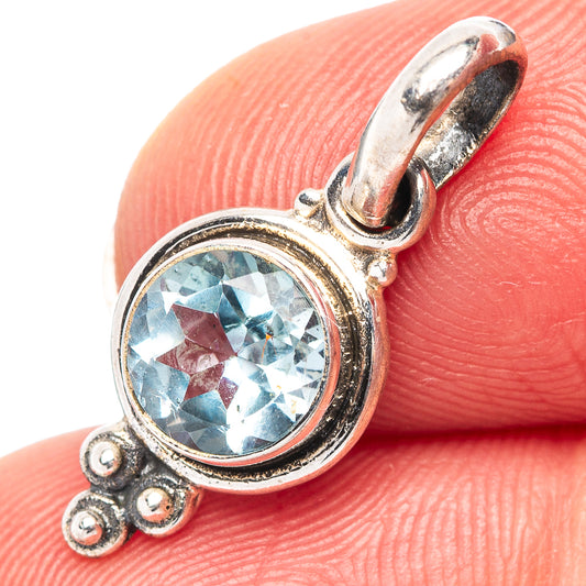 Sterling silver blue topaz pendant with round gemstone, ornate halo and bail