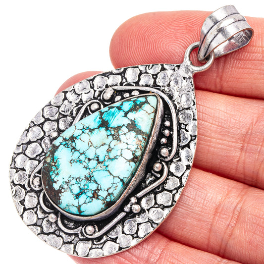 German silver turquoise teardrop pendant with ornate rope border and bail