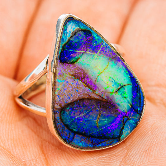 Sterling silver opal ring, side view of teardrop stone with electric blue and purple flash