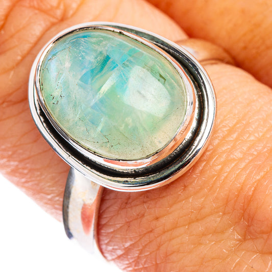 Oval green opalescent moonstone cabochon set in .925 sterling silver bezel ring