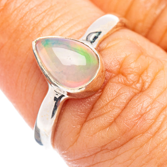 Sterling silver opal ring with oval bezel and iridescent opal cabochon