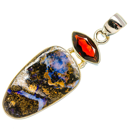 Teardrop boulder opal and garnet pendant on 925 sterling silver bail