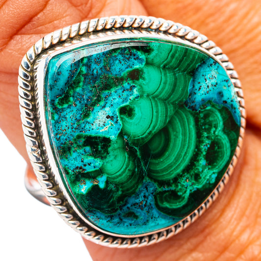 Sterling silver ring with oval turquoise-green gemstone cabochon and rope bezel