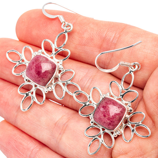 Sterling silver thulite drop earrings with pink oval stones in ornate petal settings
