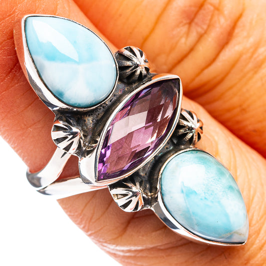 Sterling silver ring on hand, oval larimar and amethyst in ornate star-cut bezels