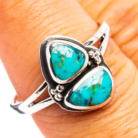 Turquoise double-stone sterling silver ring with ornate bezel and teardrop settings