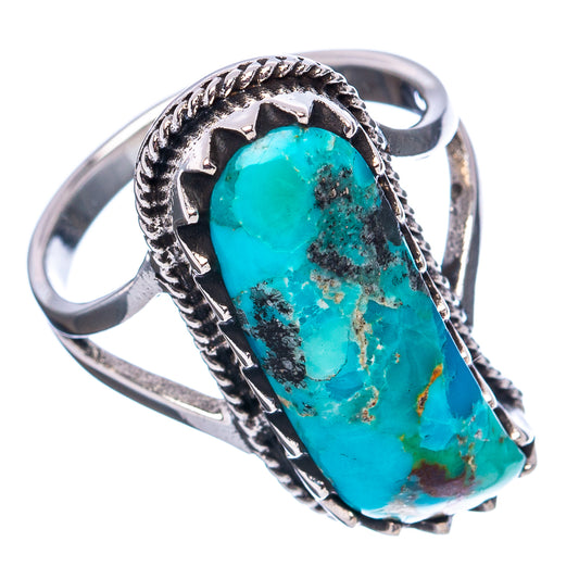 Turquoise oval gemstone ring in ornate silver frame with rope-style edge, side view