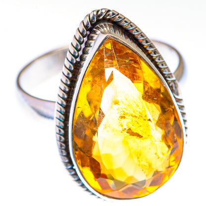 Sterling silver citrine teardrop ring with faceted center and braided rope band