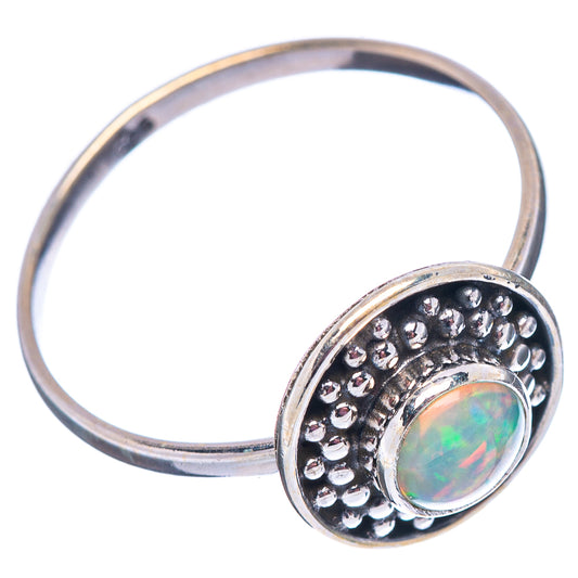 Round opal set in beaded halo on sterling silver ring band, side view