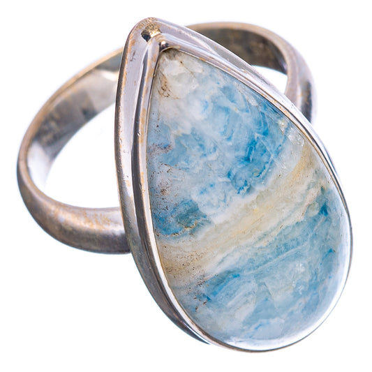 Oval blue scheelite sterling silver ring, side view showing open band