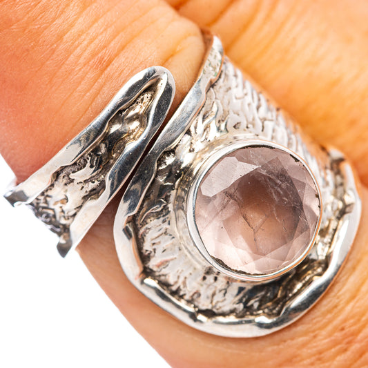 Rose quartz ring with oval pink stone set in ornate .925 sterling silver band