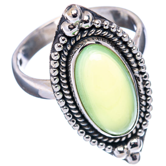 Oval green gemstone silver ring with ornate rope-and-bead bezel, scalloped shoulders