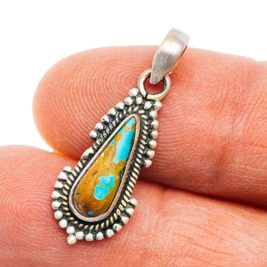 Sterling silver turquoise teardrop pendant with beaded border and loop bail.