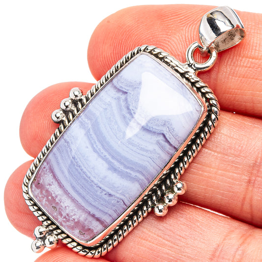 Sterling silver pendant with rectangular blue lace agate and loop bail, rope border.