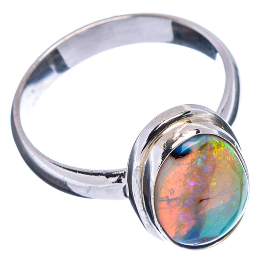Sterling silver opal ring with oval iridescent gemstone, visible band and setting