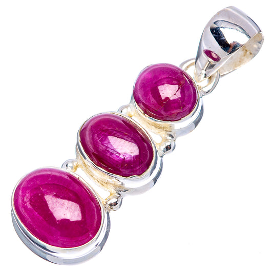 Three oval ruby cabochons on .925 sterling silver pendant bail, side view