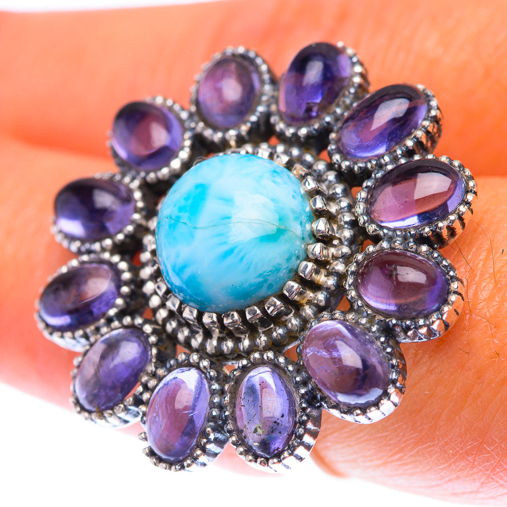 Sterling silver ring with oval blue larimar center and purple oval gemstones halo