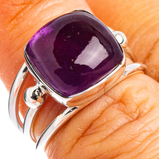 Amethyst purple oval ring with sterling silver band, open bezel setting
