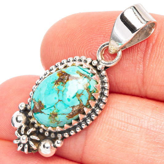 Turquoise cabochon pendant in 925 sterling silver with ornate bezel and bail
