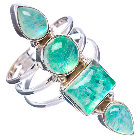 Silver ring with green oval, teardrop, and emerald-cut moonstone-style stones, angled