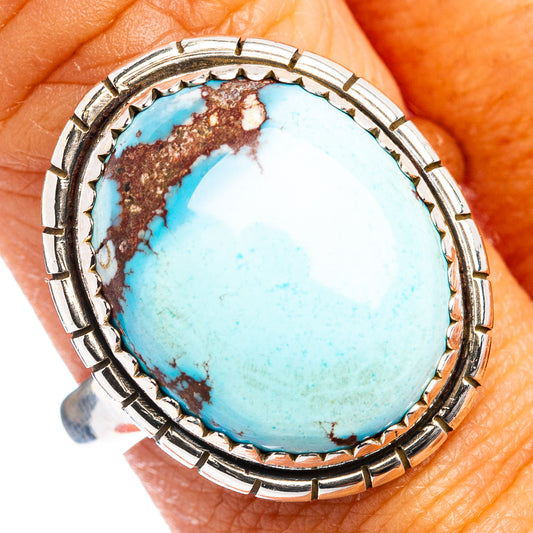 Turquoise cabochon ring with oval blue stone and silver scalloped bezel.