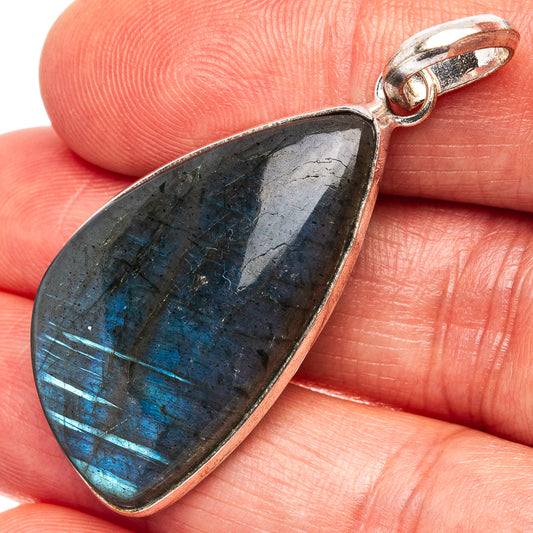 Silver-plated labradorite pendant with teardrop stone and blue shimmer, silver bezel bail