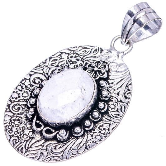 Oval moonstone pendant in textured German-silver oval frame with bead and floral engraving