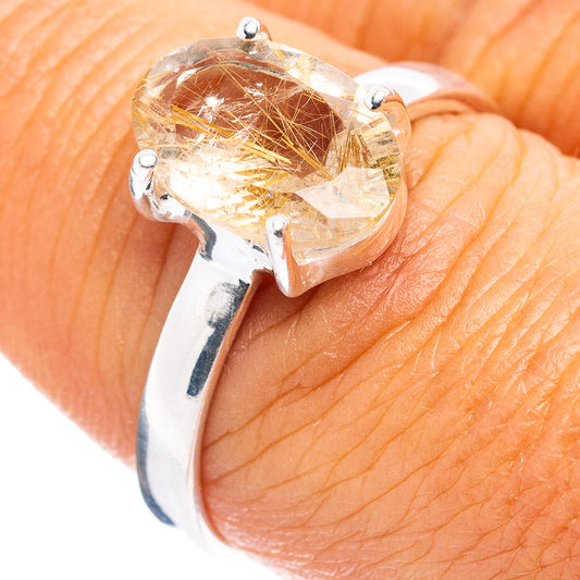 Sterling silver rutilated quartz ring with oval clear stone and gold needle inclusions