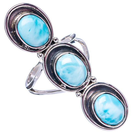 Oval three-stone larimar ring with bezel-set light-blue stones, .925 sterling silver band.
