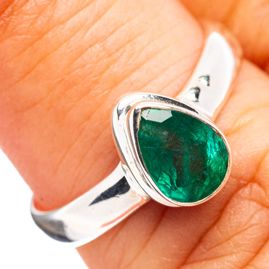 Sterling silver oval emerald ring with raised bezel, size 6