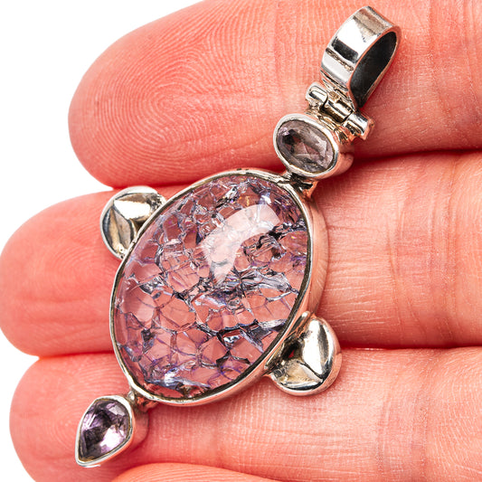 Close-up of oval crackle quartz pendant with three amethyst accents in .925 silver.
