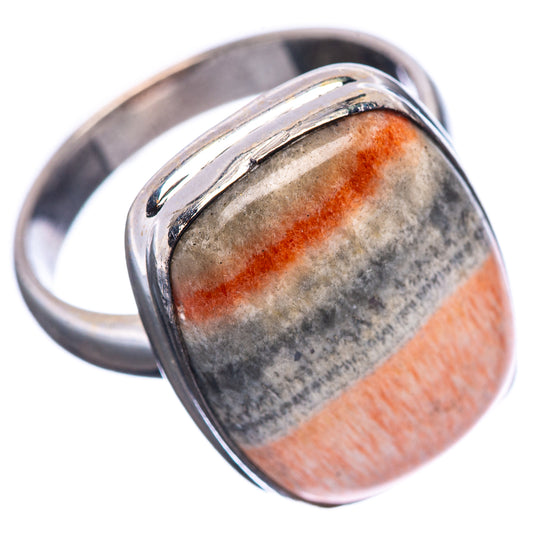 Sterling silver oval cabochon ring, angled view, orange stripe with gray speckles