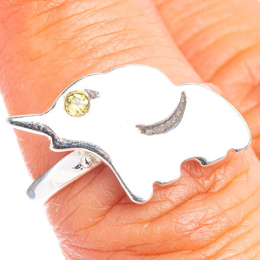 Elephant-shaped sterling silver ring with peridot green round gemstone, size 6.5