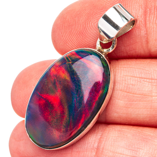 Oval opal pendant in .925 sterling silver with iridescent rainbow color and bail