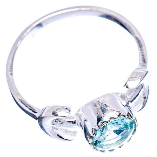 Sterling silver ring with oval blue topaz stone and twisted split band