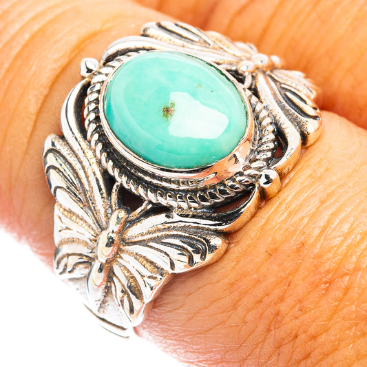 Sterling silver ring with oval turquoise cabochon and detailed butterfly wings