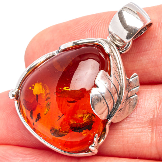 Oval amber pendant with .925 sterling silver leaf frame and open bail