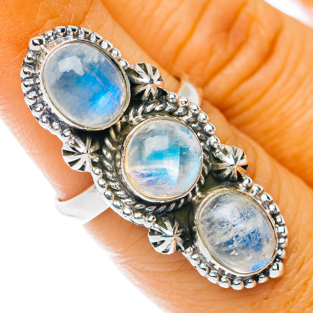 Sterling silver moonstone ring with three oval blue-sheen stones and ornate bezel accents