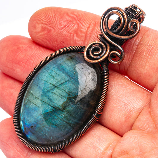 Oxidized copper wire-wrapped labradorite oval pendant, blue-green flash detail