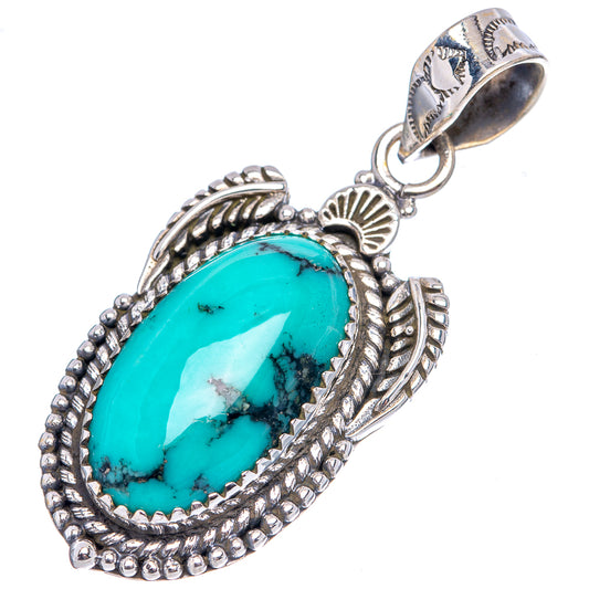 Turquoise oval pendant with .925 sterling silver bail and detailed leaf border